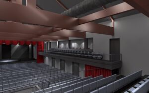 A large auditorium with many seats and a red ceiling.