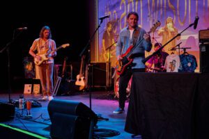 A band performing on stage at an event.